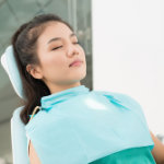 Photo of dental patient resting in dental chair