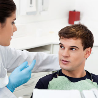 Endodontist talking to a patient